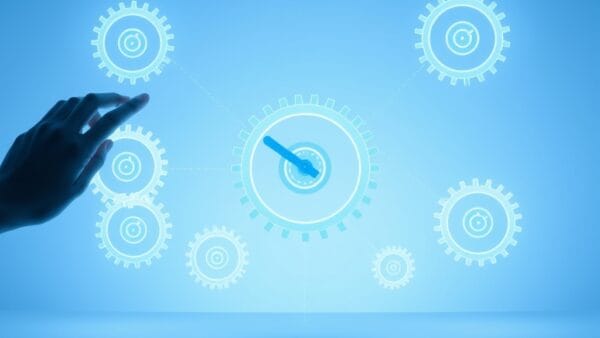 Illustration IA : engrenages lumineux représentant l'automatisation des tâches par l'IA